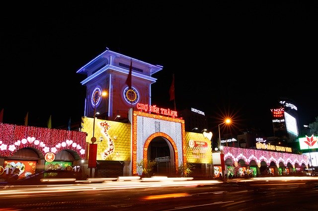 outside at night lit up Ben Thanh Market ho chi minh vietnam